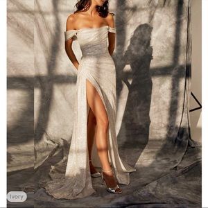 Sparkling off shoulder evening dress with slit